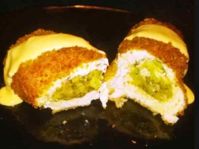 Fried Chicken Breast Stuffed with Broccoli and drizzled in cheese sauce
