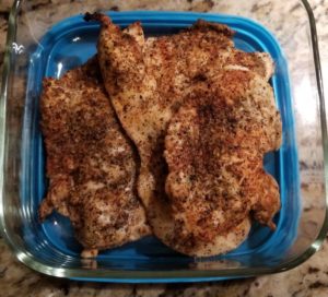 Baked Chicken Breast in glass storage container