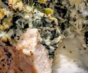 Creamy Spinach and Cheese Oozing from a cooked chicken breast