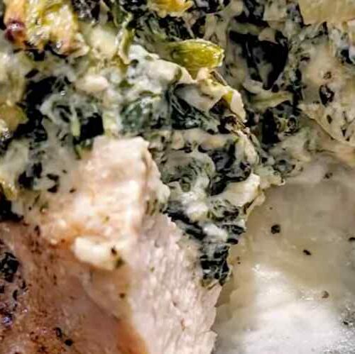 Creamy Spinach and Cheese Oozing from a cooked chicken breast