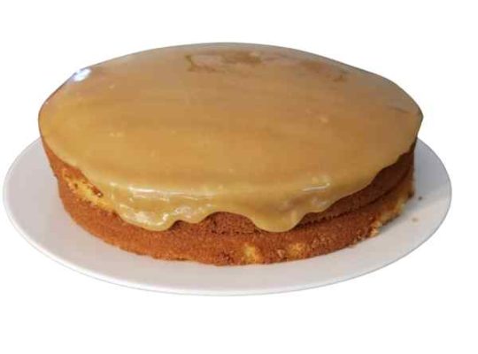 Caramel frosting dripping down cake